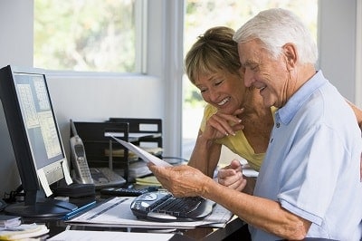 Seniors doing research regarding the financial benefits of a continuing care retirement community