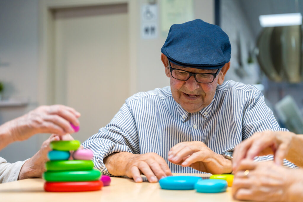 Elderly Man Completing Skill Game