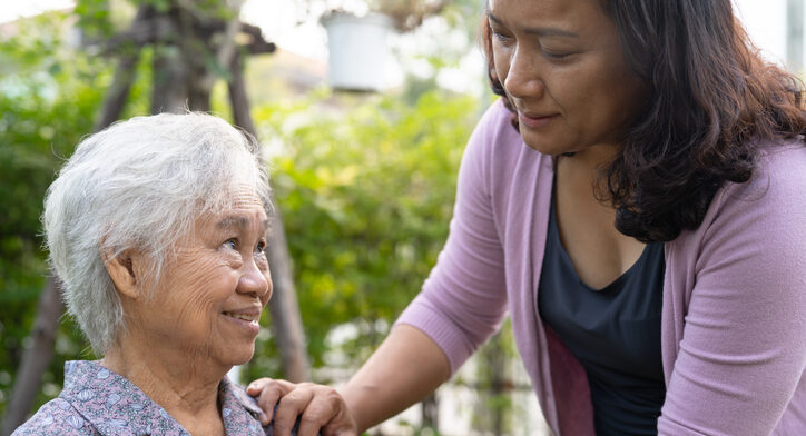 Caregiver Helps Elderly Woman